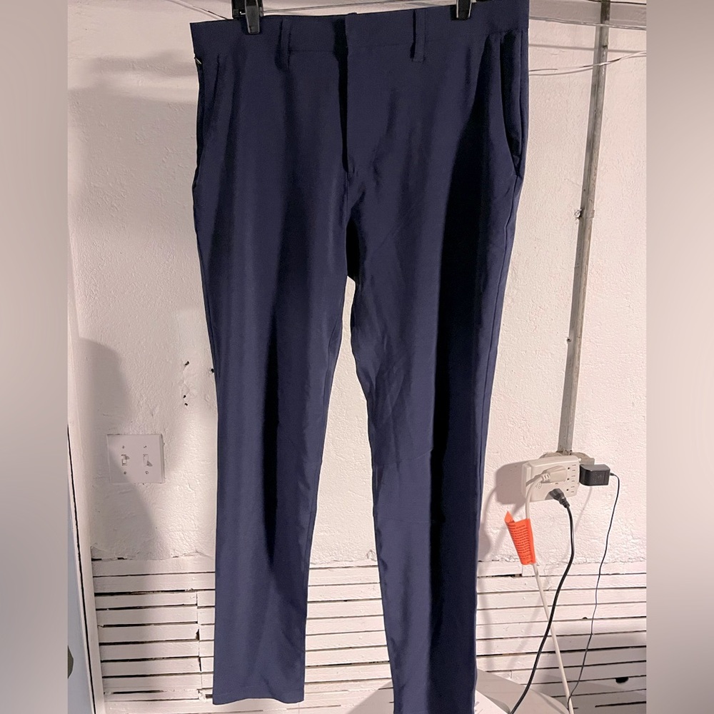 Fabletics navy tech fabric tailored pants.